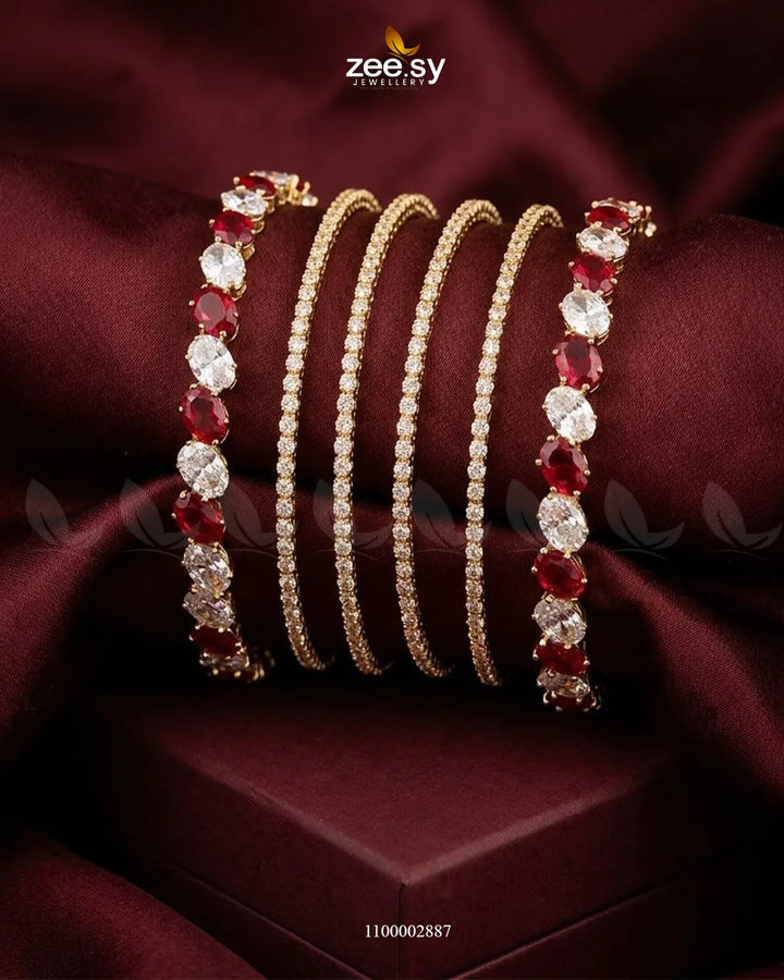 Red oval gemstone paved bangles by AJ03 featuring a stylish design with sparkling gemstones and a polished finish.