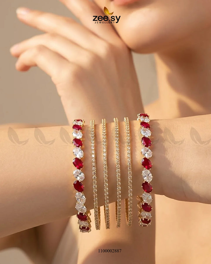 Red oval gemstone paved bangles from AJ03, featuring intricate gemstone detailing on elegant bangle bracelets.