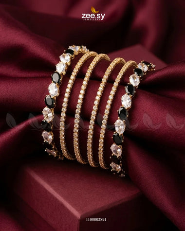 Black oval gemstone paved bangles with intricate detailing, showcasing elegant jewelry design by AJ03.