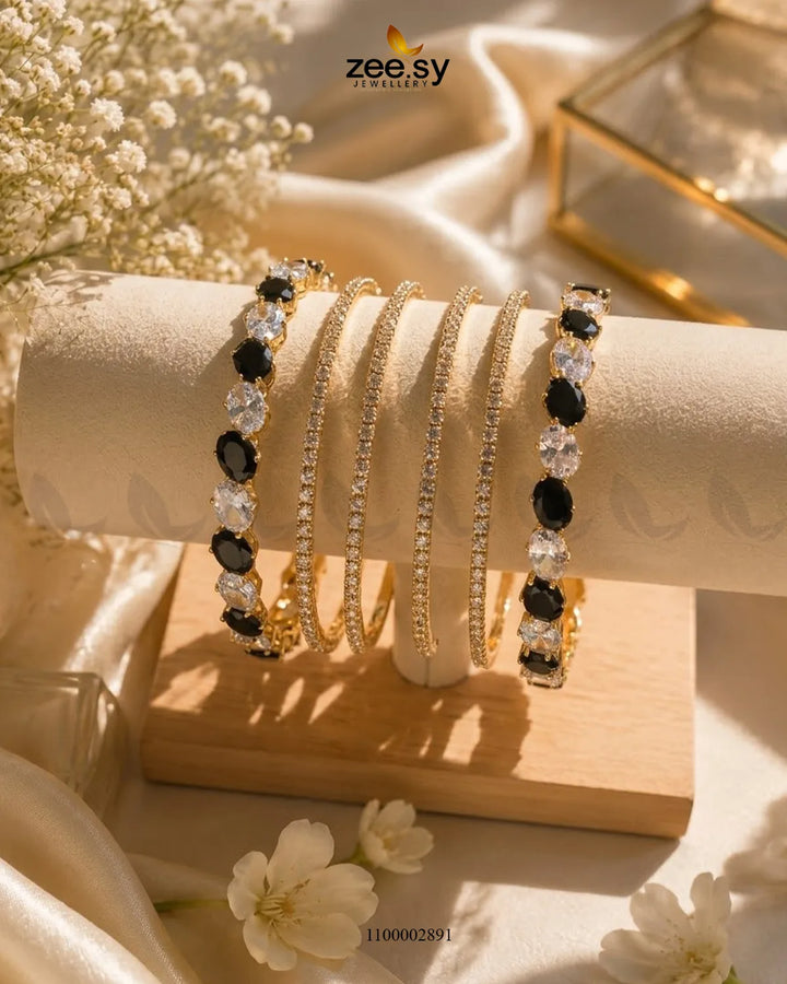 Black oval gemstone paved bangles from AJ03 with intricate gemstone detailing and elegant design.