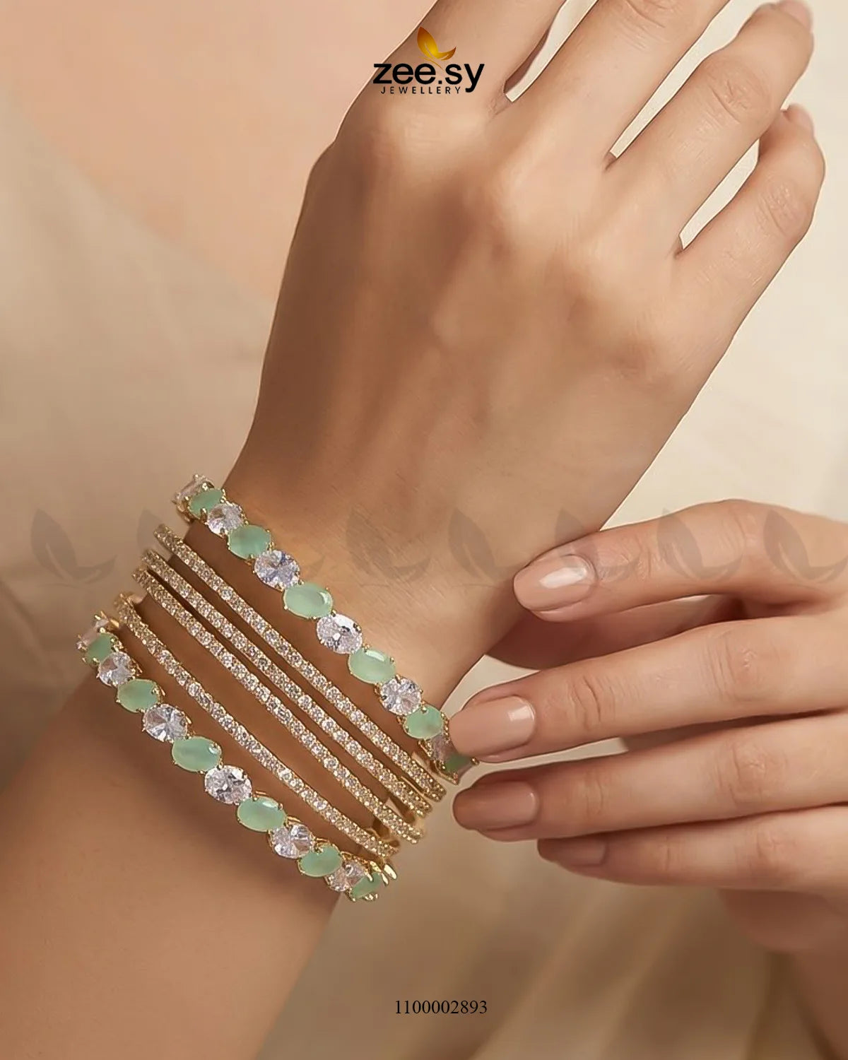 Mint green oval gemstone paved bangle by AJ03, featuring a stylish design with sparkling gemstone accents on a sleek bangle.