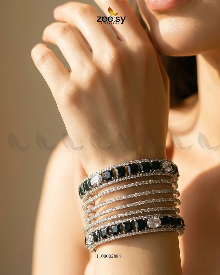 Silver princess cut zirconia bangle from AJ03 featuring sparkling gemstone accents and a sleek, elegant design.