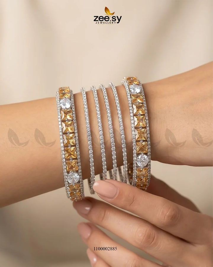 Silver princess cut zirconia bangle with sparkling clear stones, elegant jewelry piece from AJ03 brand.