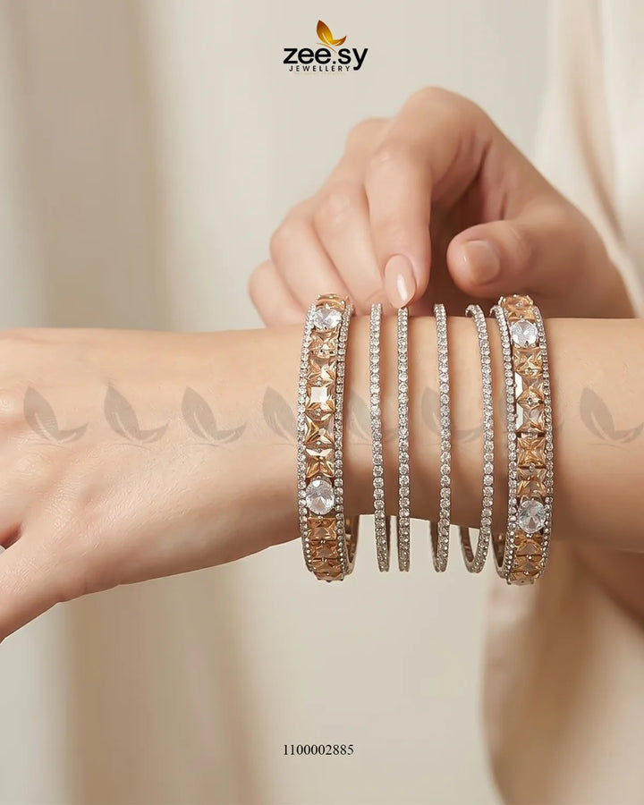 Silver princess cut zirconia bangle with sparkling stones, elegant jewelry accessory perfect for special occasions.