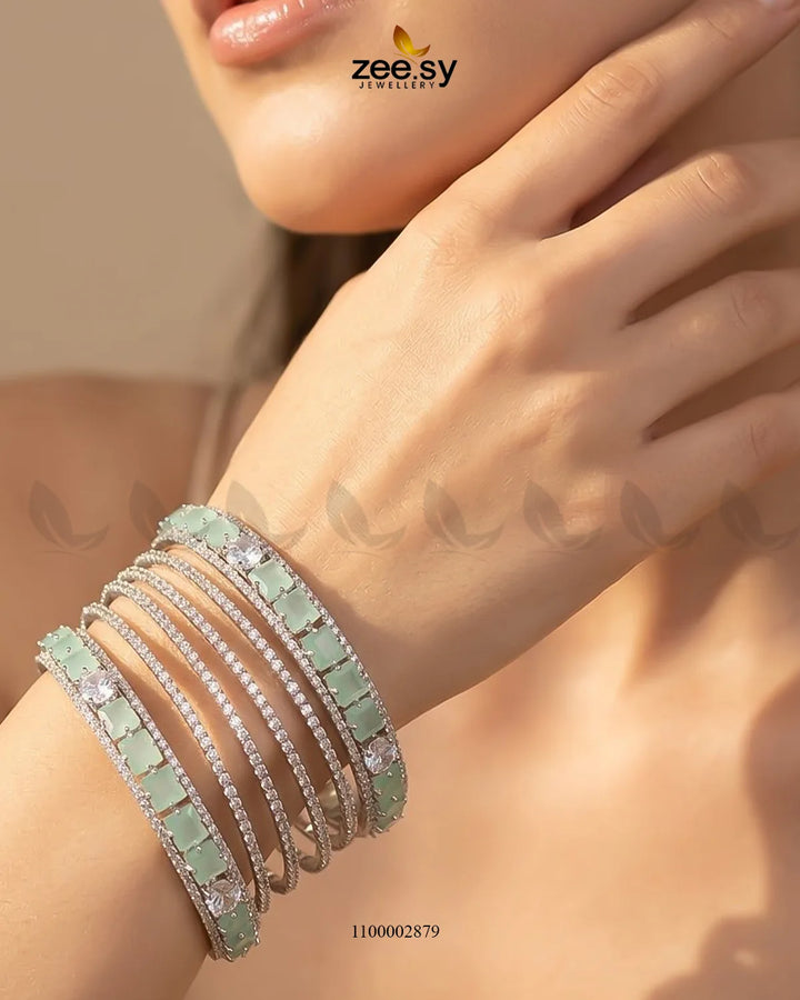 Silver princess cut zirconia bangle with mint green accents, featuring elegant design and sparkling stones from AJ03.