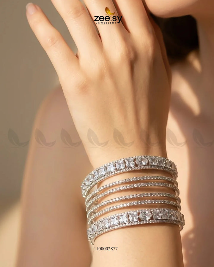 Silver princess cut zirconia bangle from AJ03 featuring sparkling cubic zirconia stones on a sleek bracelet design.