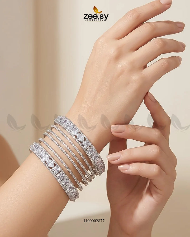 Silver princess cut zirconia bangle by AJ03 featuring sparkling cubic zirconia stones on a sleek bracelet design.