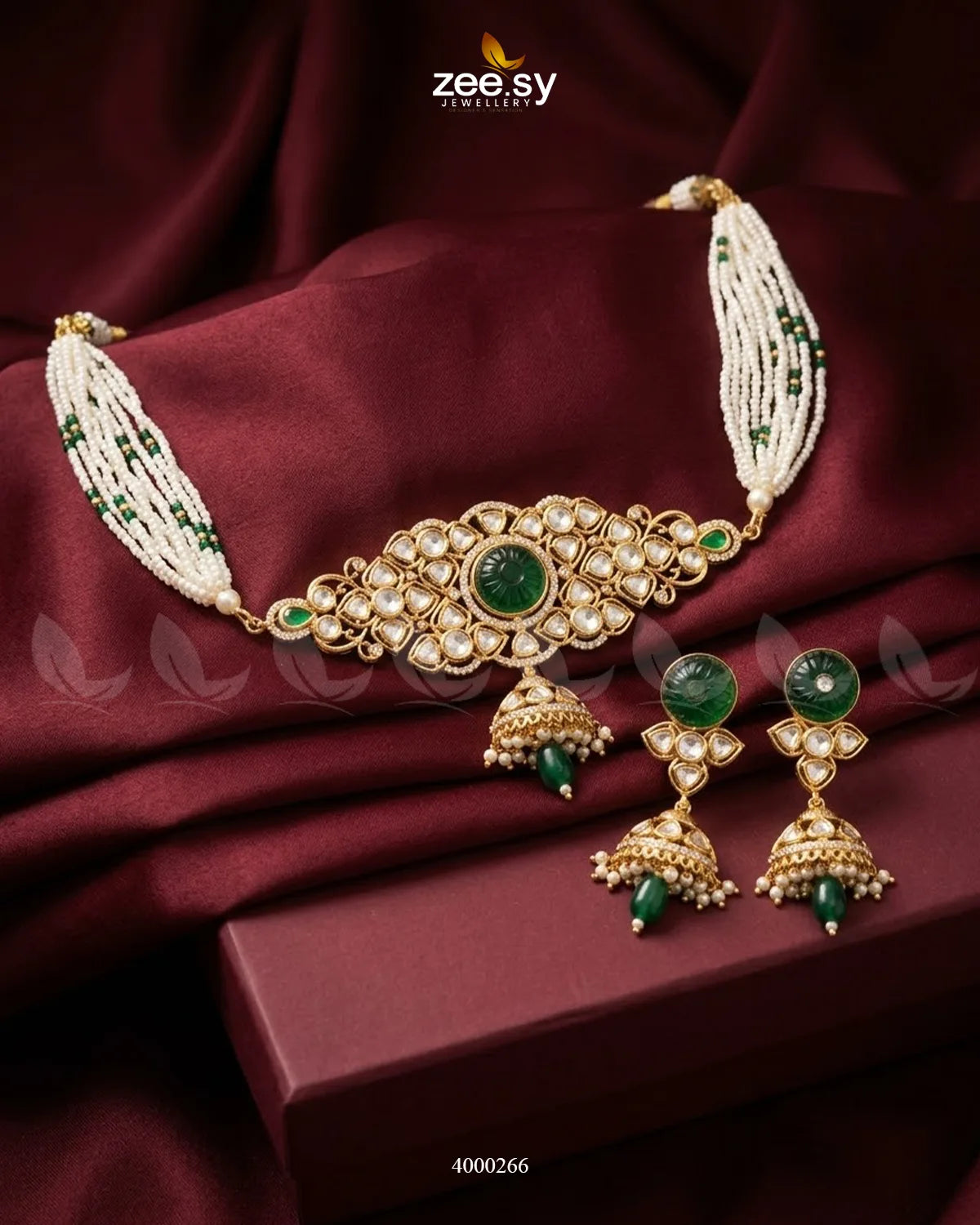 Green Radiance Pearl Jhumki choker set with intricate gold detailing and hanging pearl jhumkis, traditional jewelry for festive occasions.