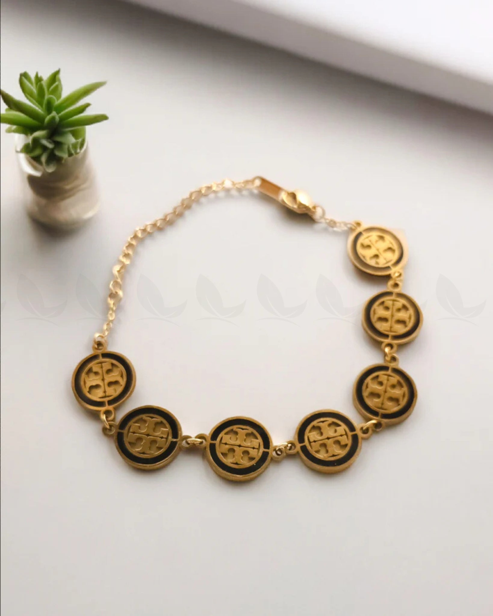 Renegade Gold Toned Logo Link Bracelet - Zeesy Jewellery