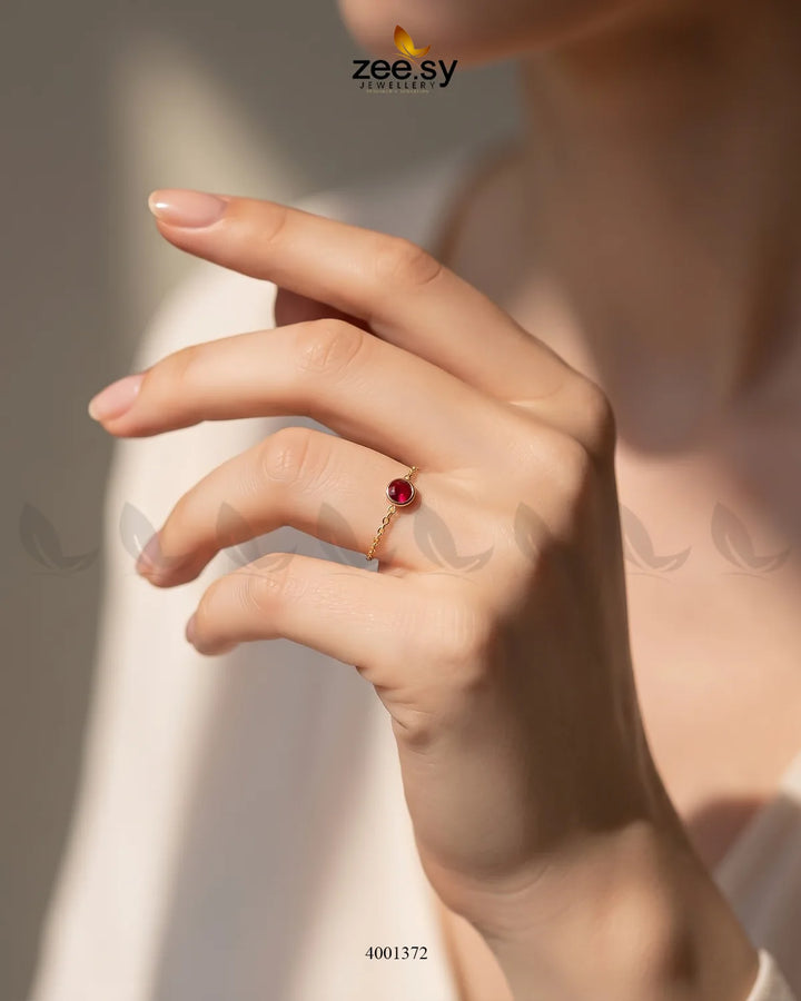 AJ03 Scarlet round stone finger ring with vibrant red gemstone and silver band, close-up view of the stylish jewelry.