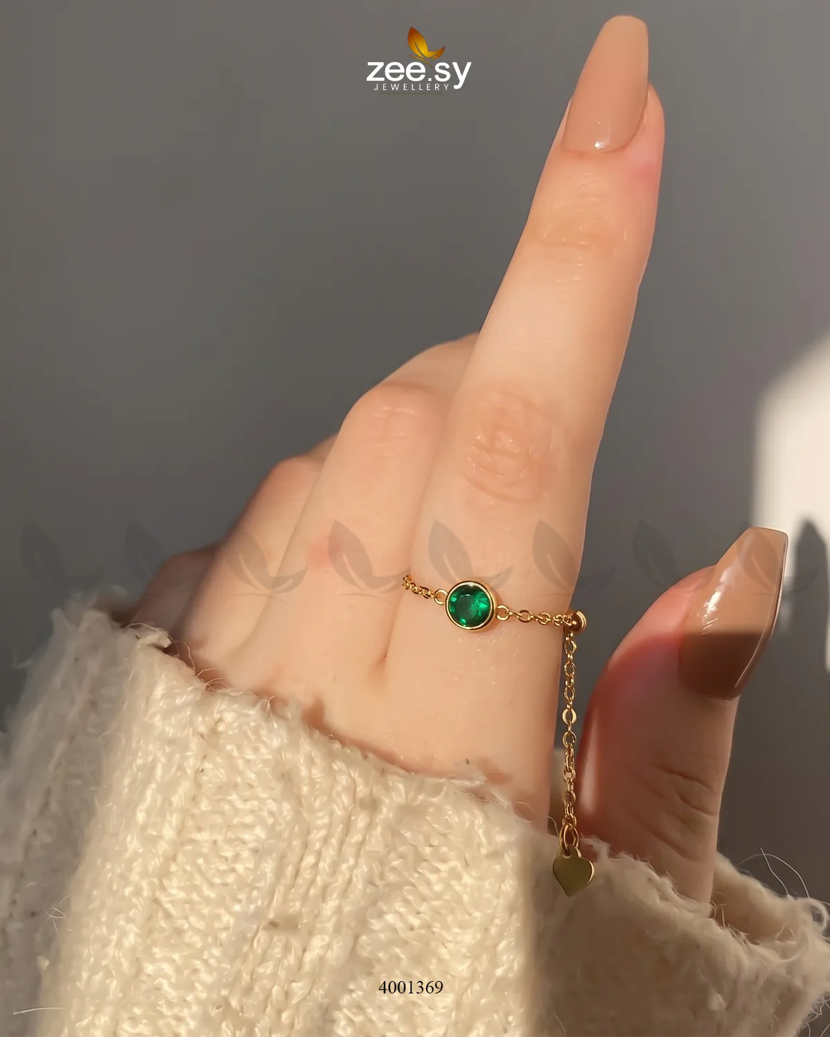 Green scarlet round stone finger ring by AJ03, showcasing a vibrant gemstone set in a sleek band design.