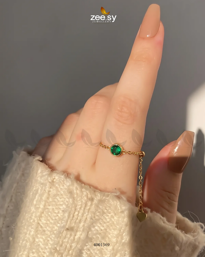 Green scarlet round stone finger ring by AJ03, showcasing a vibrant gemstone set in a sleek band design.