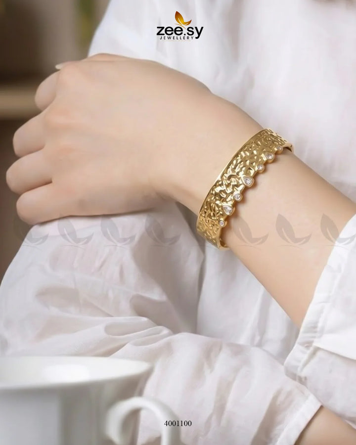 Sculptural textured crystal cuff bracelet by MH26 featuring an artistic, chunky design with sparkling crystal accents.