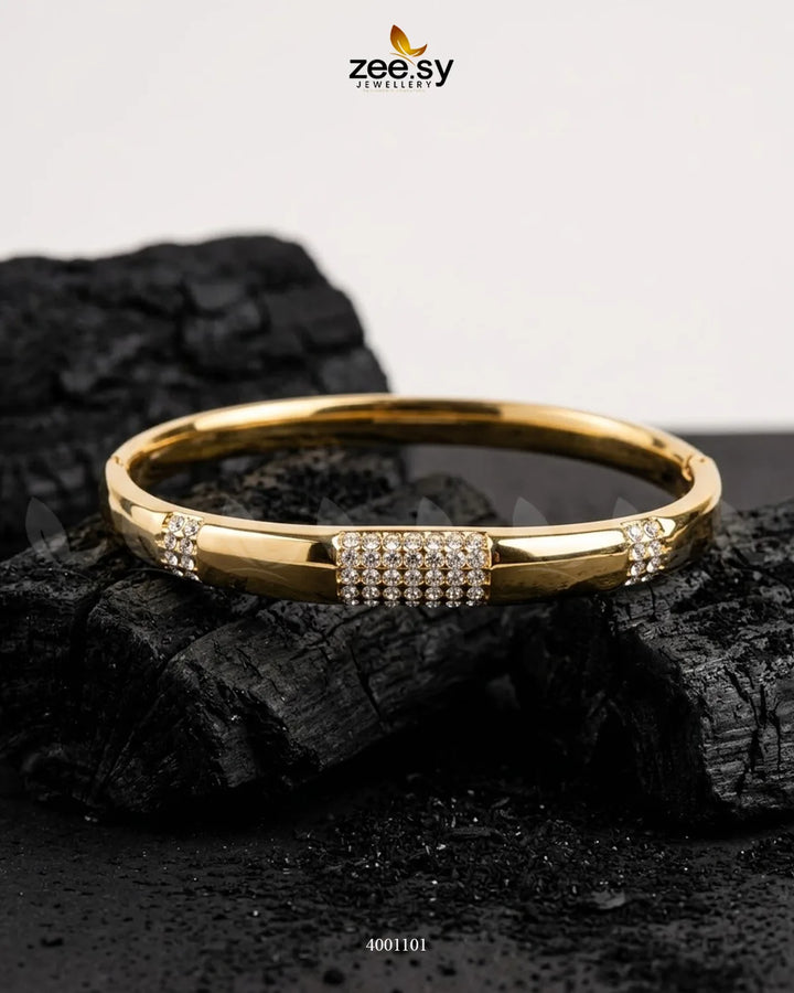 MH26 segmented crystal cuff bracelet featuring sleek, geometric design with sparkling crystal segments on a metal band.