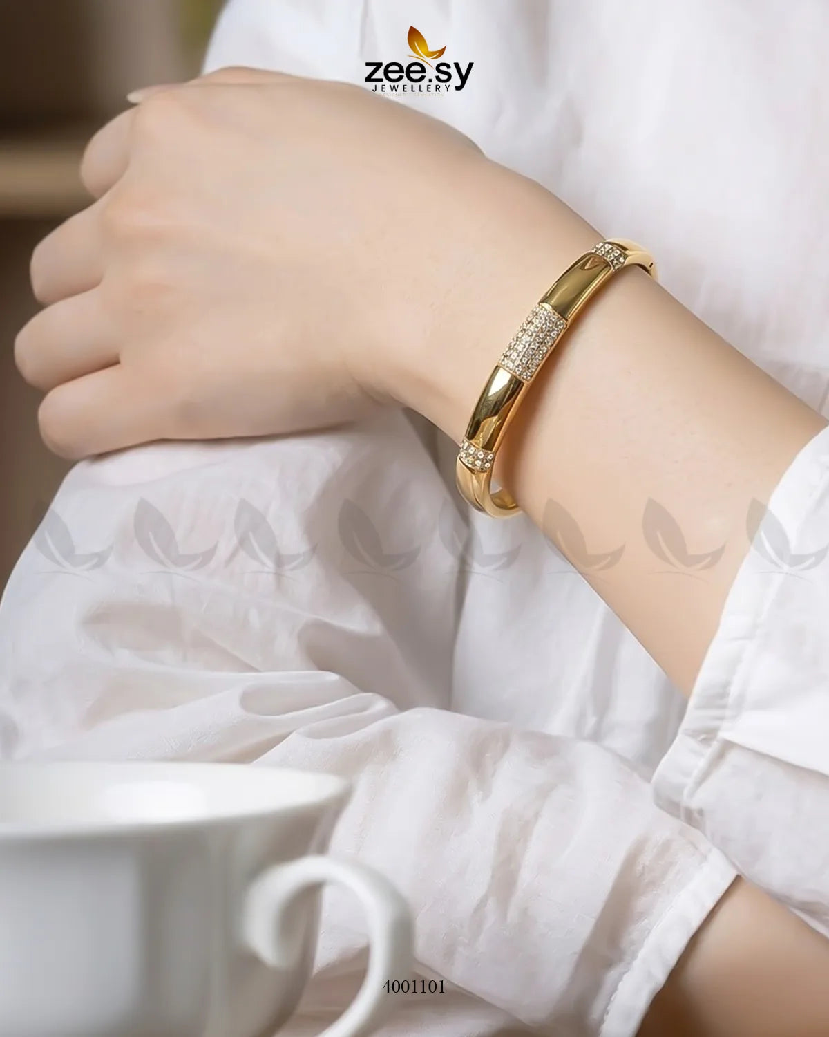 MH26 segmented crystal cuff bracelet featuring geometric crystal segments and a sleek metallic band on a neutral background.