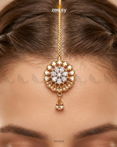 RHS09 Solis Bindiya in champagne color, traditional decorative bindiya with intricate design and elegant style.