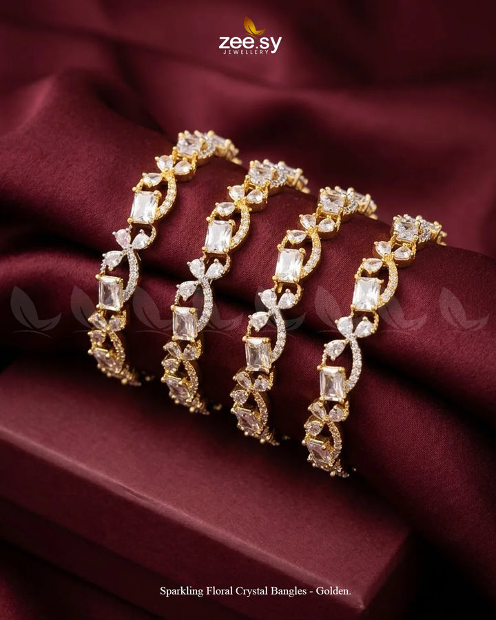 Golden sparkling floral crystal bangles from RHS09, featuring intricate designs and shimmering accents for elegant wristwear.