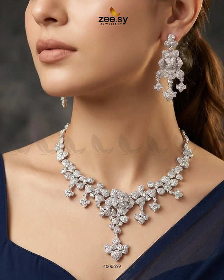 Silver sparkling zirconia necklace set with matching earrings, featuring intricate design and shimmering stones from RHS09.