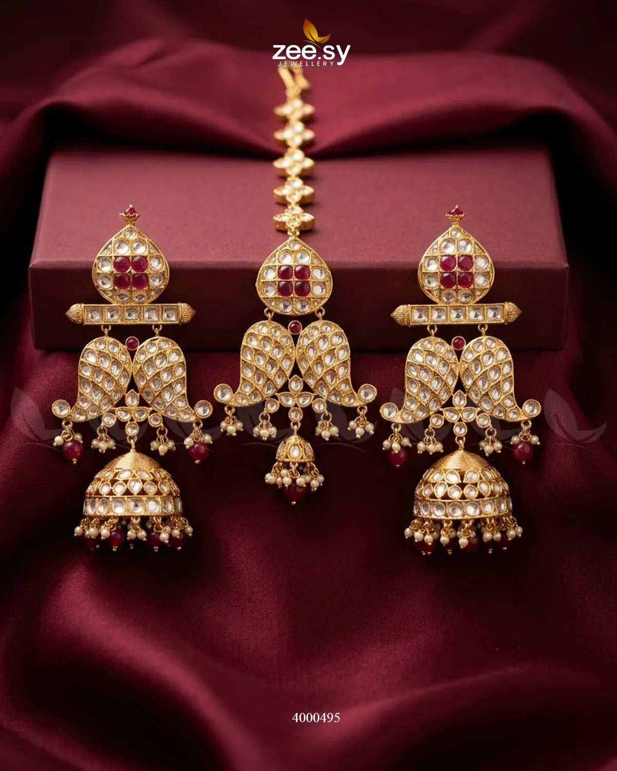 Traditional Polki Jhumki earrings with intricate silver detailing and hanging beads, showcasing elegant Indian jewelry design.