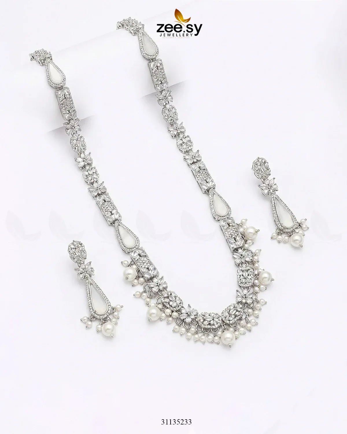 Silver necklace set with pearls and crystals on a white background, branded 'zeesy'.