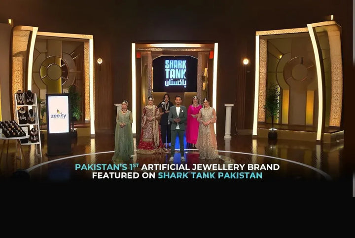 Promotional image of a jewelry brand on Shark Tank Pakistan with people on stage.
