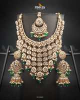 Uzma Bridal Set is intricately designed necklace set features cascading layers of dazzling stonework, creating a regal and luxurious appeal. Making it perfect for grand occasions. With fine craftsmanship and exquisite detailing.