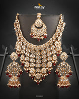 Uzma Bridal Set is intricately designed necklace set features cascading layers of dazzling stonework, creating a regal and luxurious appeal. Making it perfect for grand occasions. With fine craftsmanship and exquisite detailing.