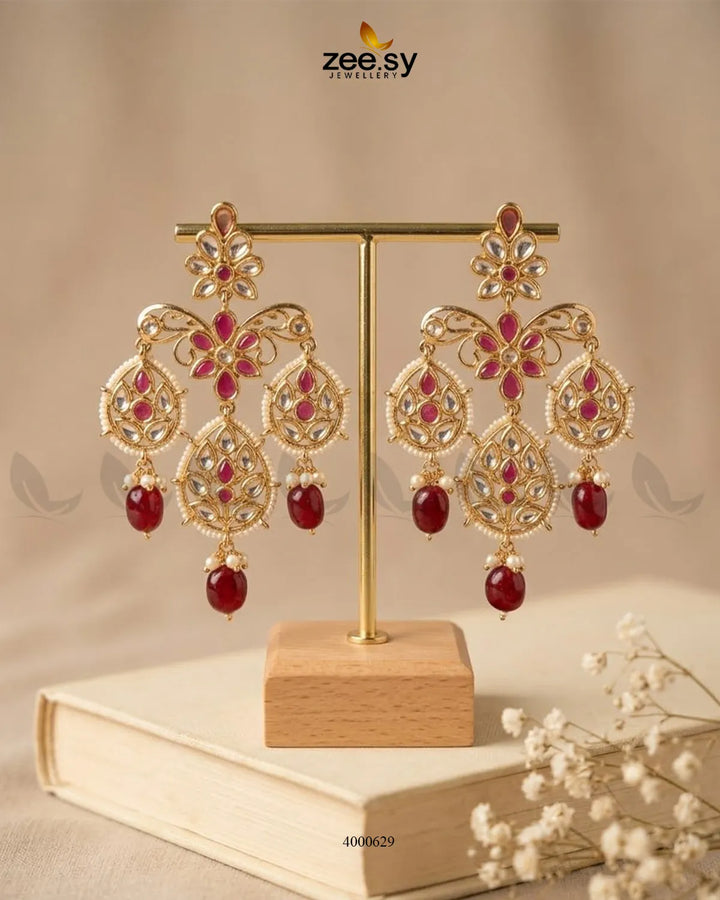 Vintage beaded Kundan earrings by RHS09 with red bead accents and ornate traditional detailing