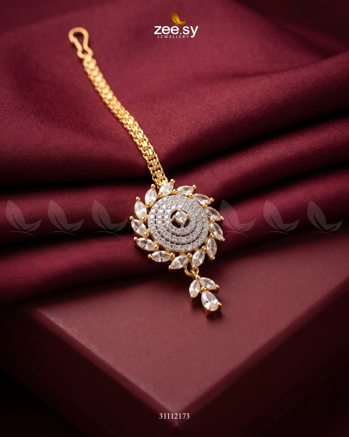 White Zayna Bindiya by RHS09, traditional decorative bindiya for forehead adornment, featuring intricate design and glossy finish.