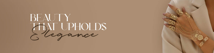 Elegant gold hand jewelry set with rings and hand chain worn by woman, luxury women’s accessories