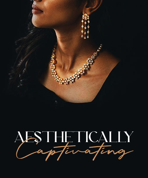 Elegant gold necklace set with matching earrings worn by woman, high-end jewelry