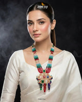 Woman wearing a colorful necklace with a dark background, featuring the Zee Sy brand.